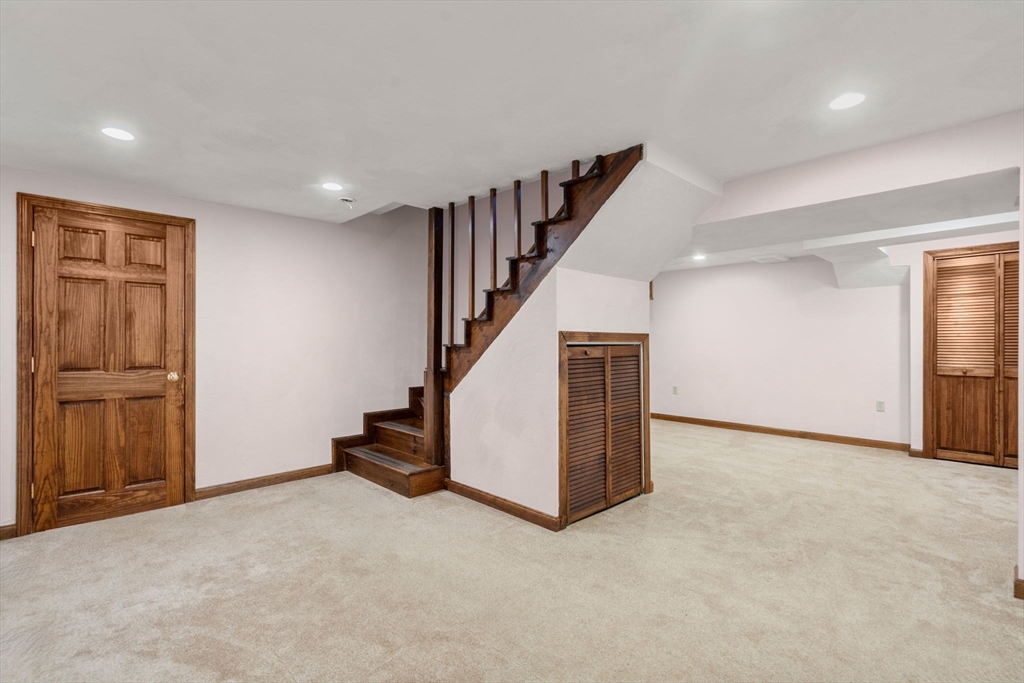 1 Maillet Drive Acton, MA 01720 - Photo 28 of 42 a view of an empty room with stairs