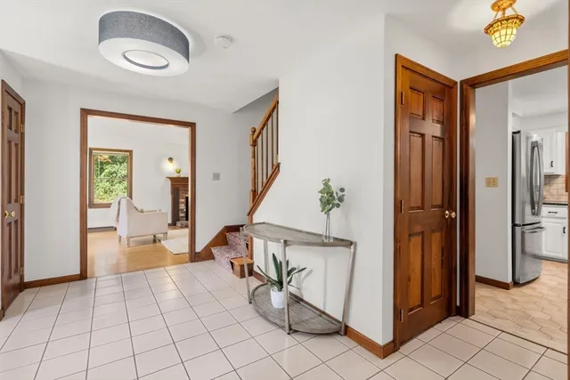 a view of an entryway with wooden floor