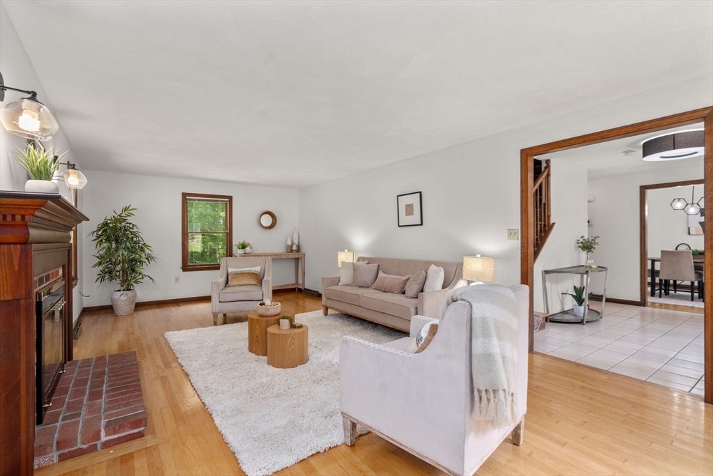 1 Maillet Drive Acton, MA 01720 - Photo 6 of 42 a living room with furniture and a wooden floor