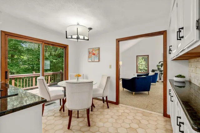 a view of a dining room with furniture window and outside view