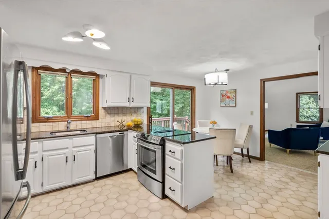 a kitchen with a sink stove and cabinets