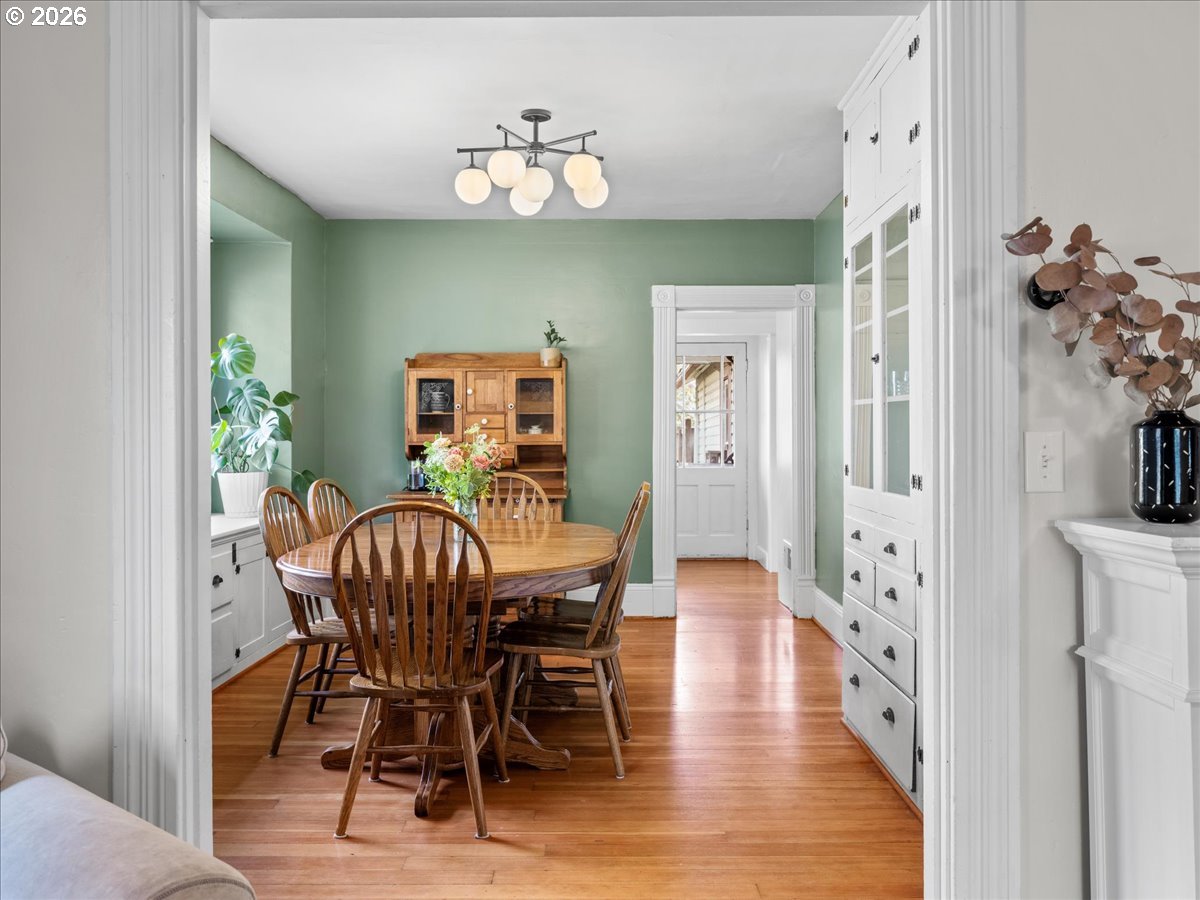 815 Shipping Street Northeast Salem, OR 97301 - Photo 19 of 45 a view of a dining room with furniture and wooden floor