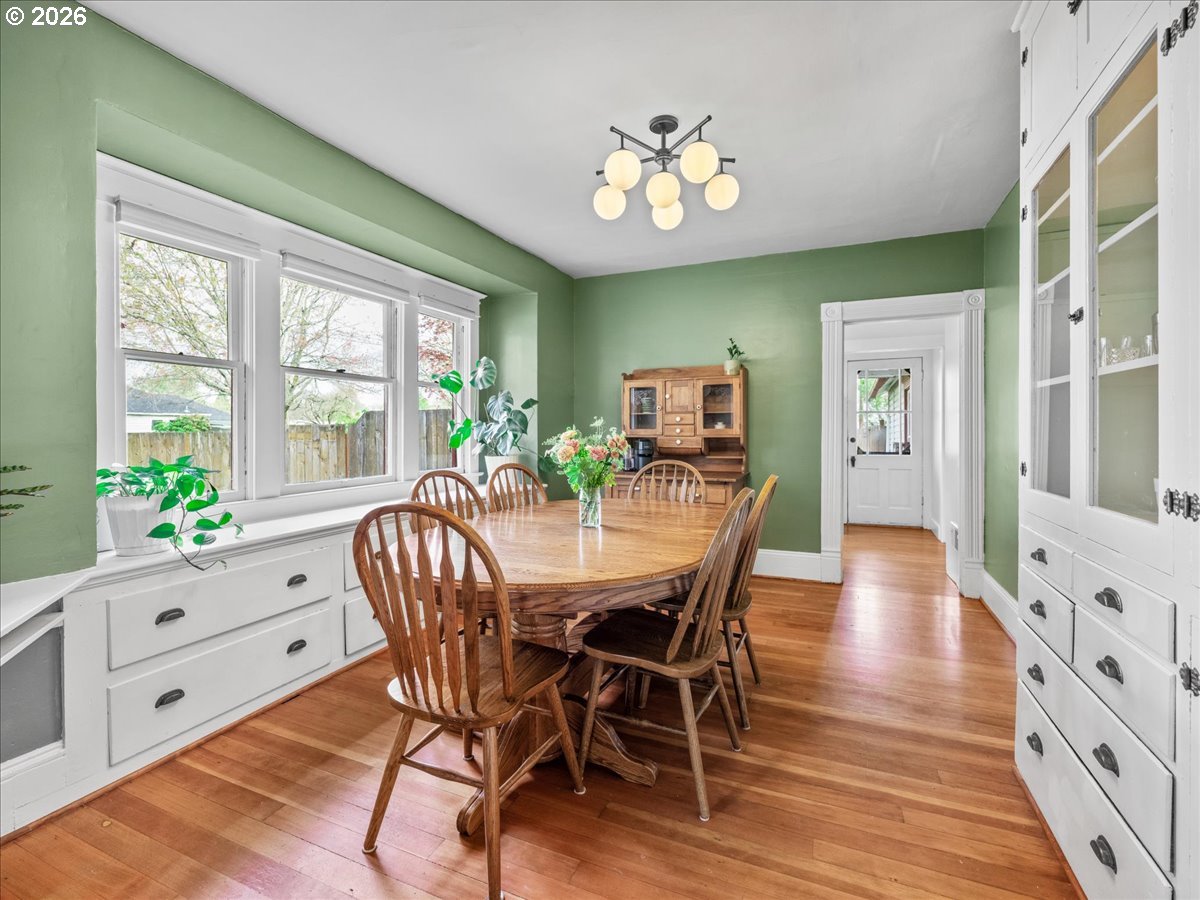 815 Shipping Street Northeast Salem, OR 97301 - Photo 20 of 45 a view of a dining room with furniture a chandelier and wooden floor