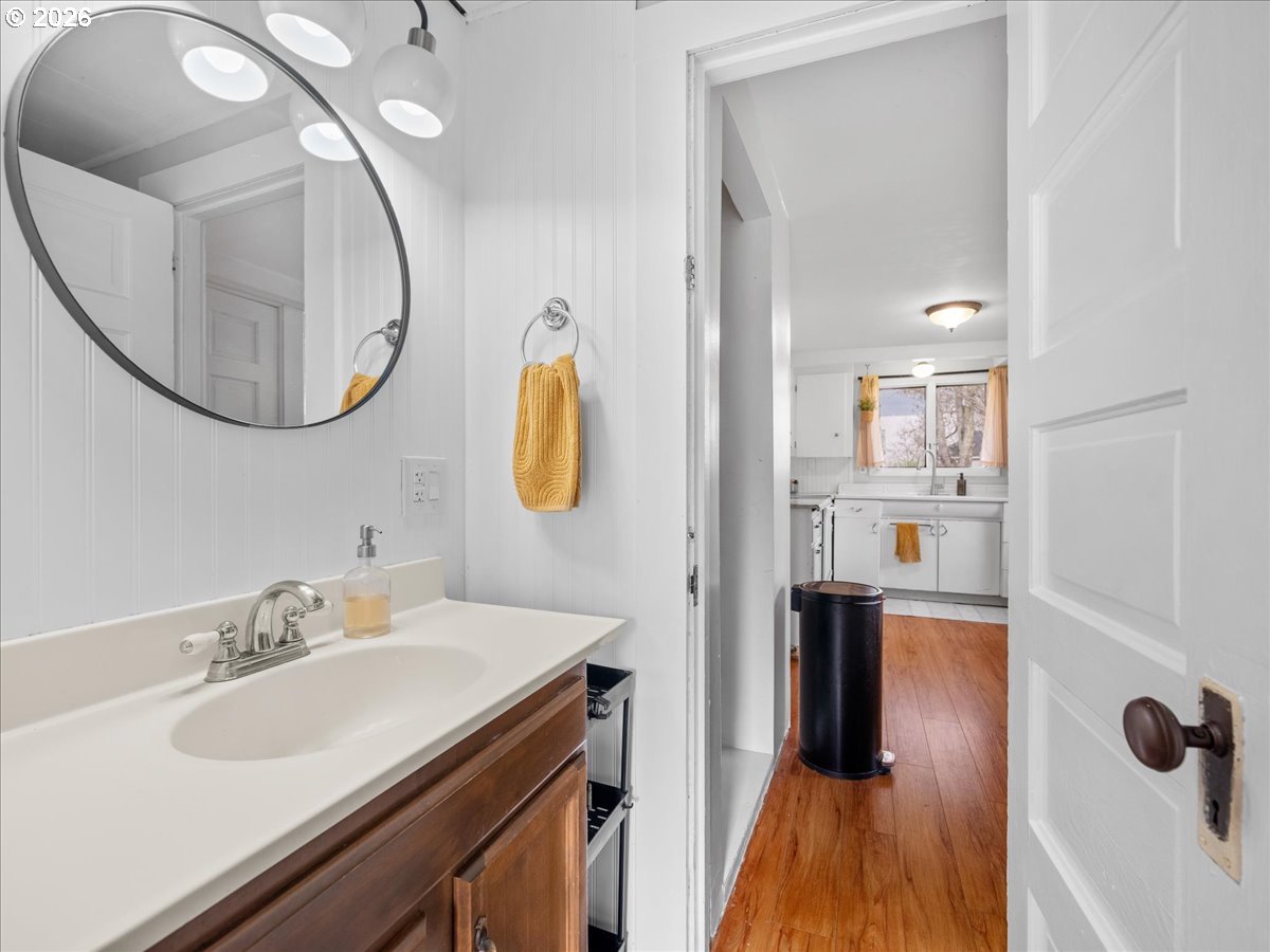 815 Shipping Street Northeast Salem, OR 97301 - Photo 26 of 45 a bathroom with a sink a mirror a vanity and shower