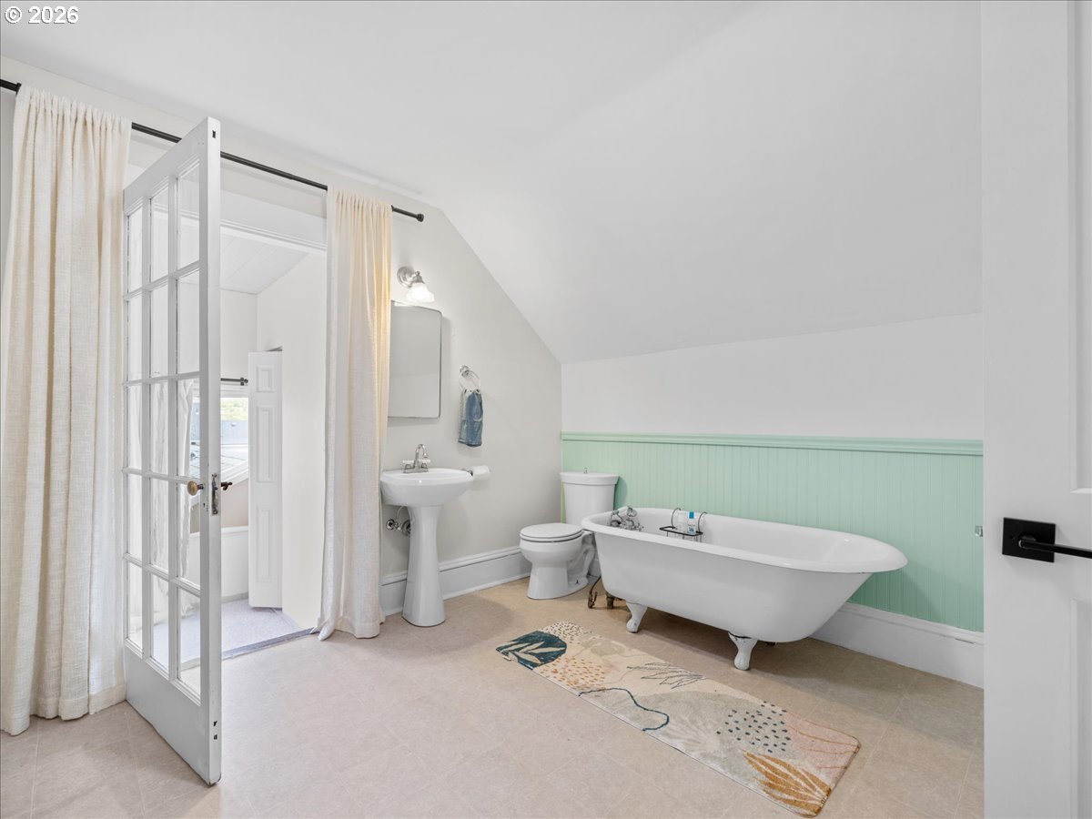 815 Shipping Street Northeast Salem, OR 97301 - Photo 29 of 45 a spacious bathroom with a double vanity sink a mirror and a shower