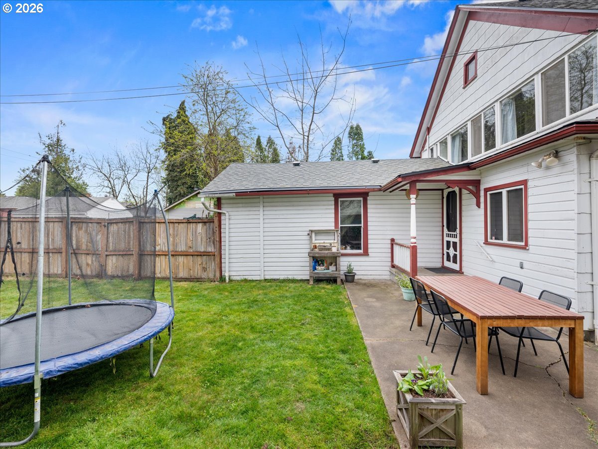 815 Shipping Street Northeast Salem, OR 97301 - Photo 40 of 45 a view of a backyard with table and chairs and a barbeque