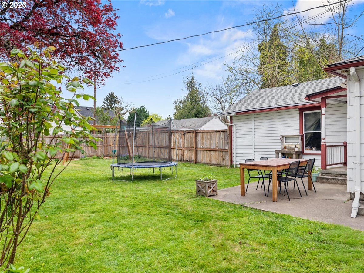 815 Shipping Street Northeast Salem, OR 97301 - Photo 42 of 45 a view of a backyard with table and chairs and a fire pit