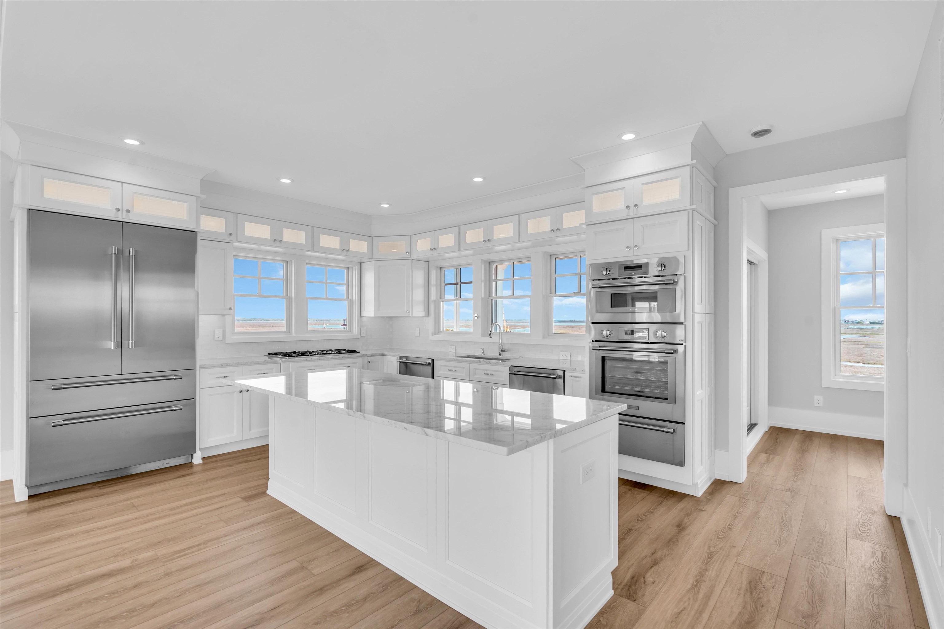 117 Taylor Strathmere, NJ 08248 - Photo 17 of 50 a kitchen with kitchen island white cabinets and stainless steel appliances