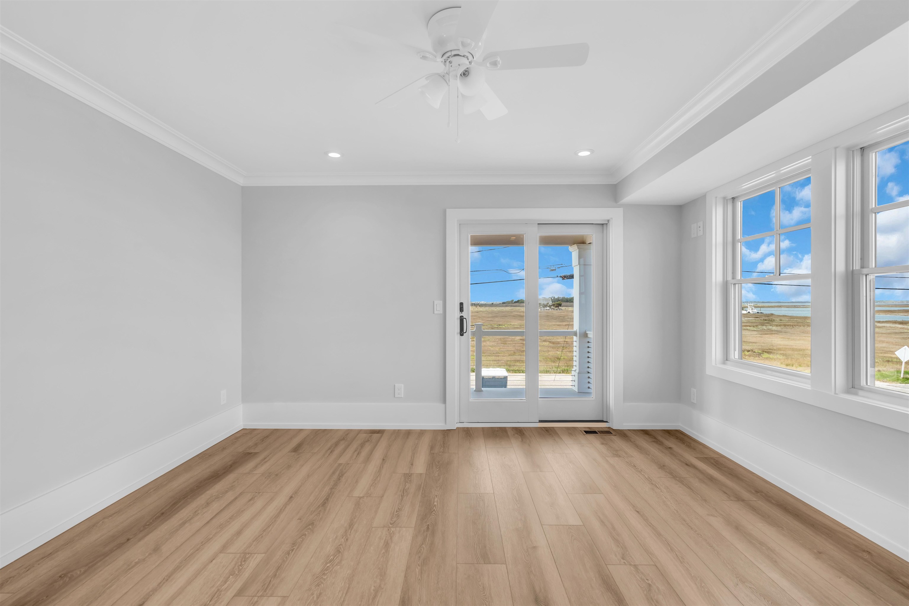 117 Taylor Strathmere, NJ 08248 - Photo 28 of 50 an empty room with wooden floor and windows