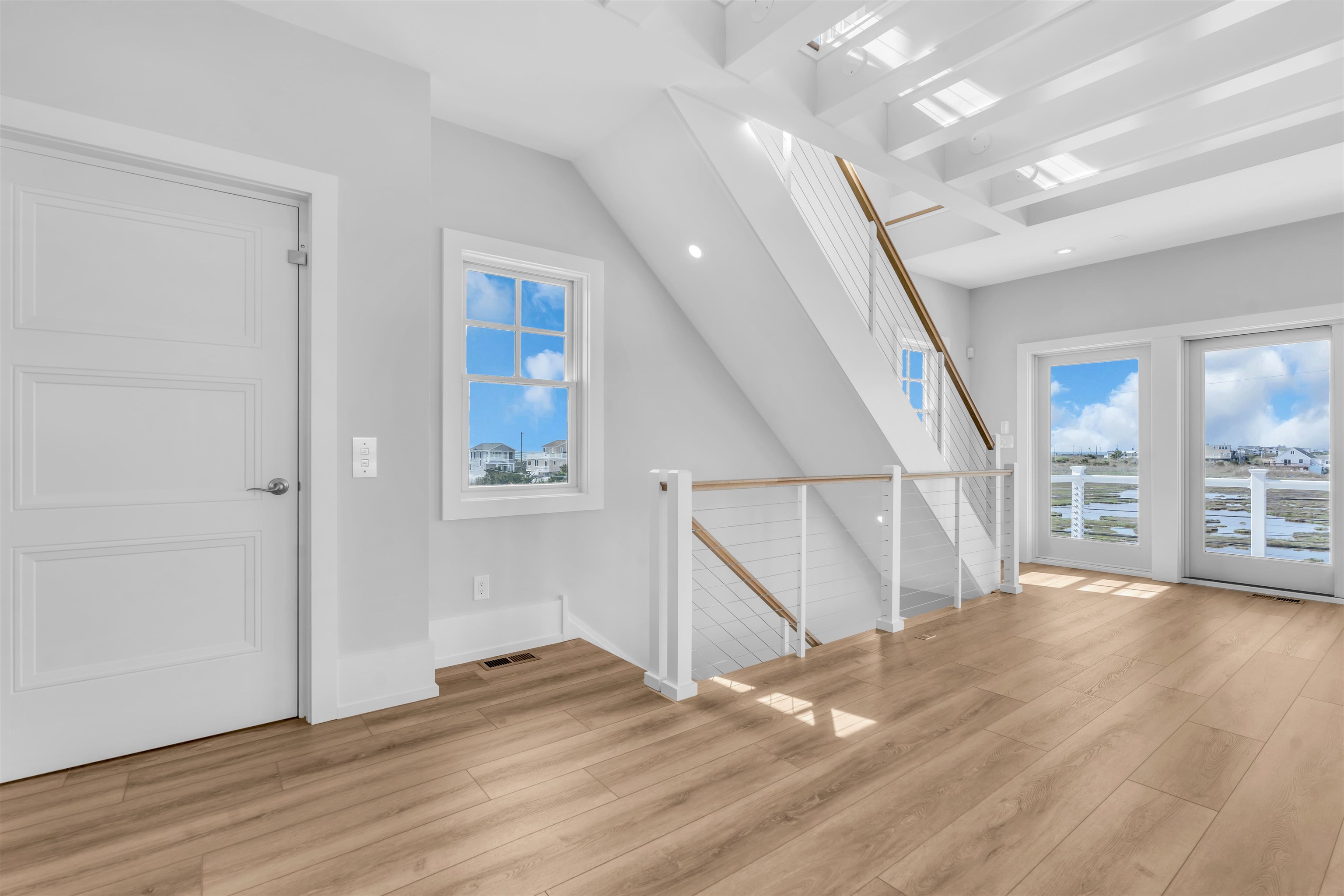117 Taylor Strathmere, NJ 08248 - Photo 41 of 50 a view of an empty room with wooden floor and stairs