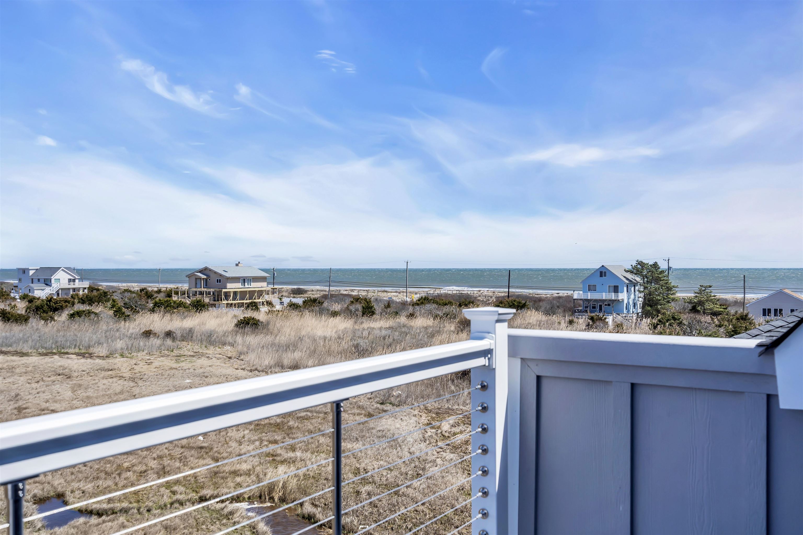 117 Taylor Strathmere, NJ 08248 - Photo 42 of 50 a view of a balcony with wooden floor and city view