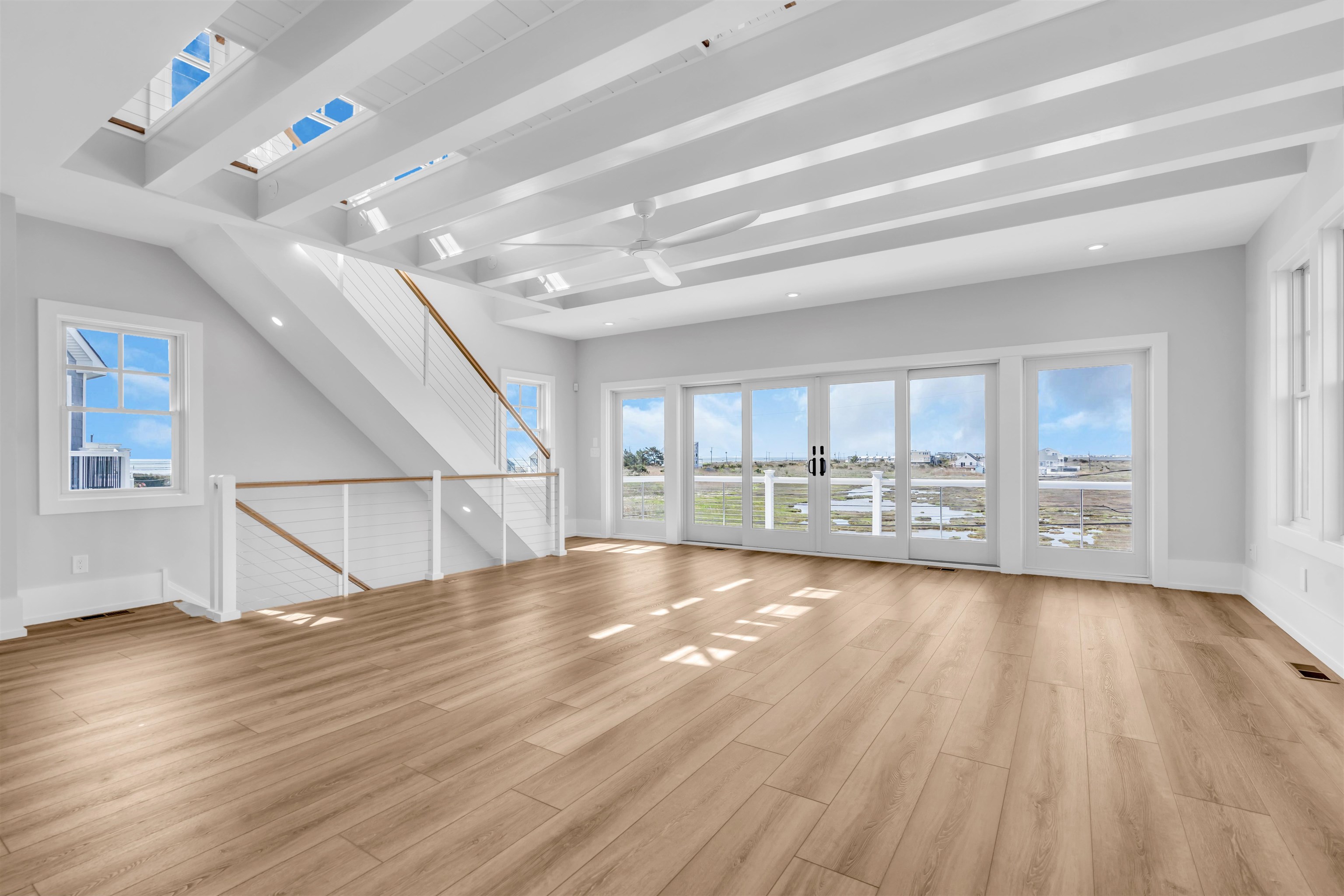 117 Taylor Strathmere, NJ 08248 - Photo 9 of 50 a view of an empty room with wooden floor and a window