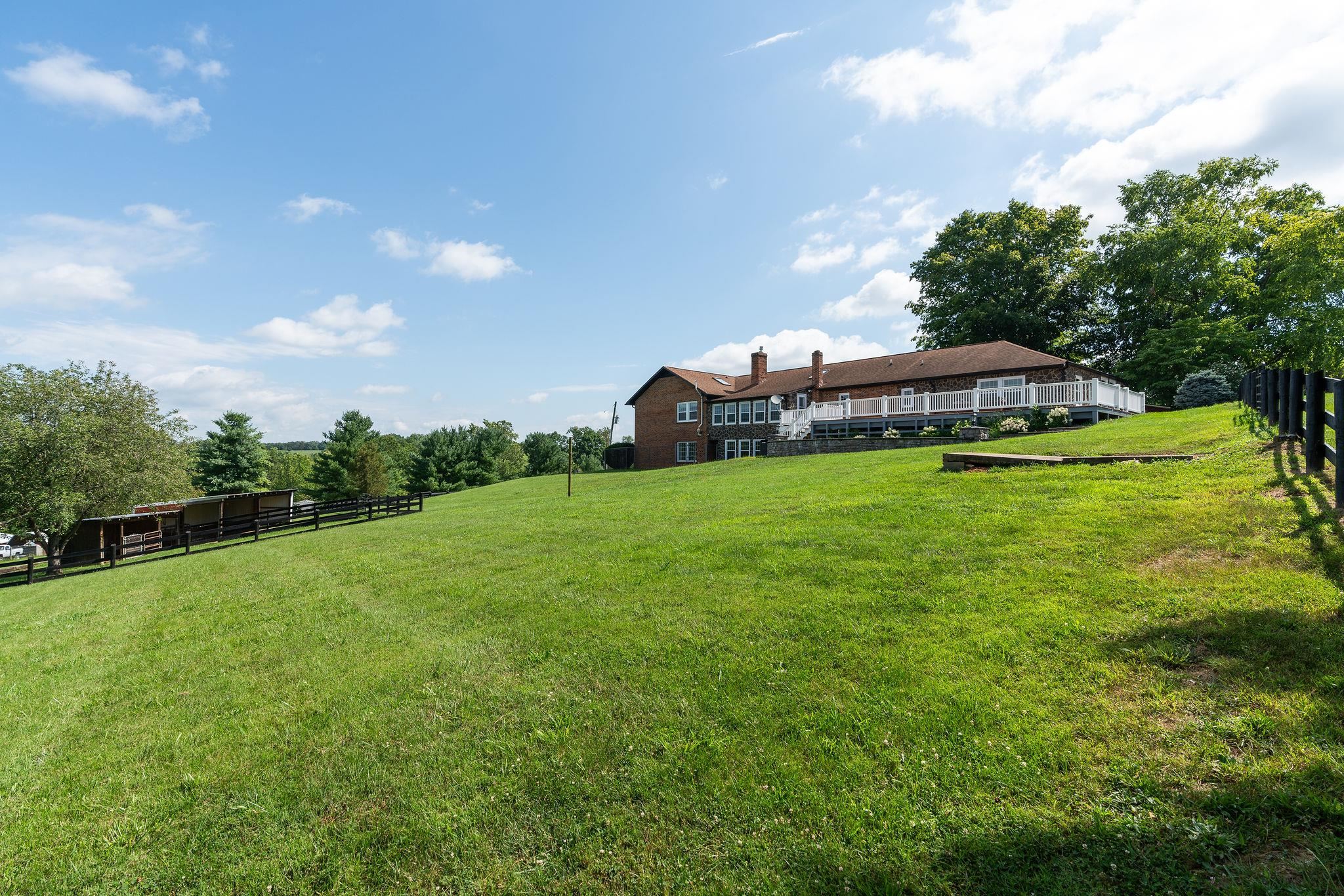 308 Stonewall Road Weyers Cave, VA 24486 - Photo 23 of 71 a view of a house with a yard and sitting area
