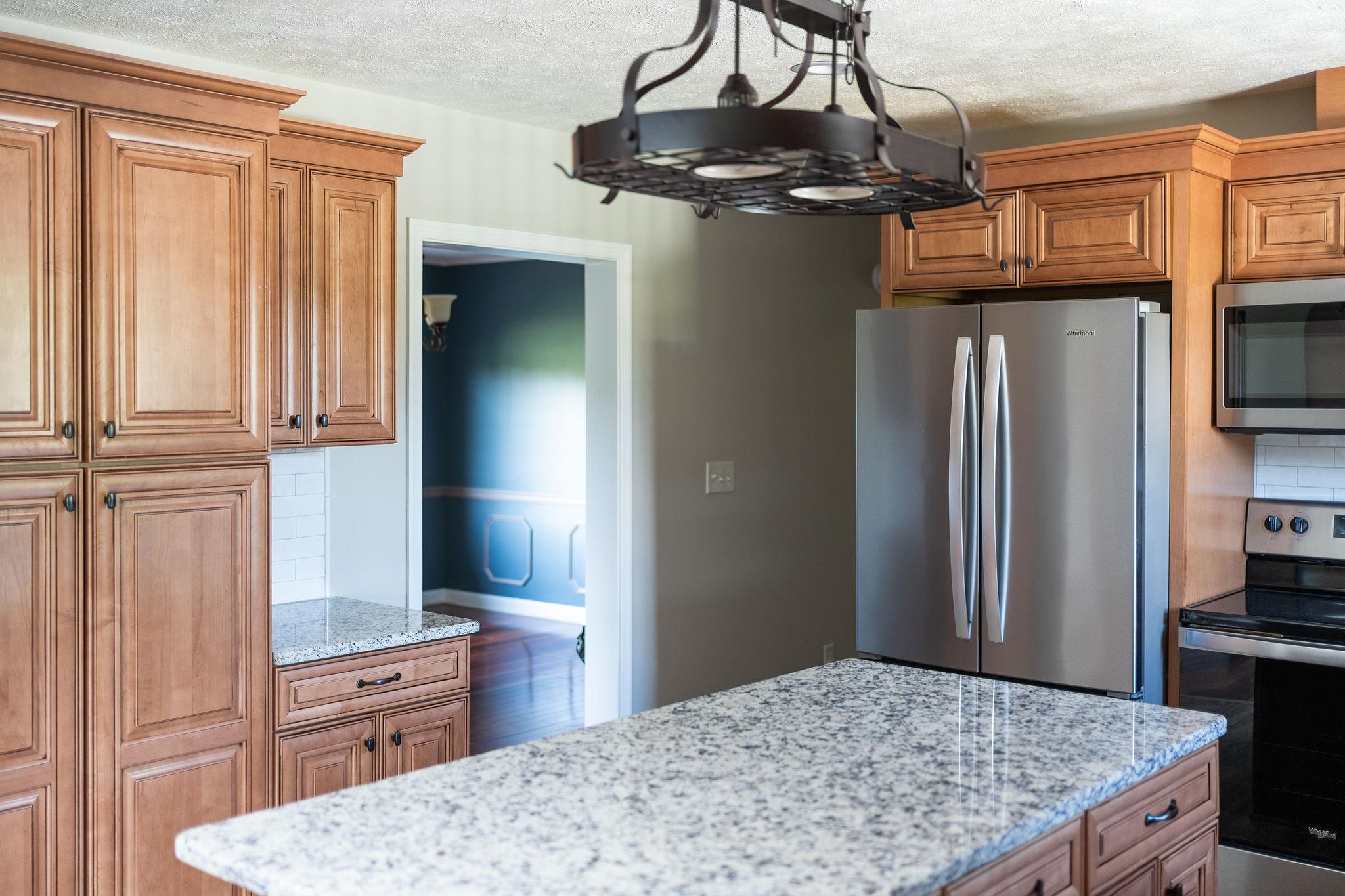 308 Stonewall Road Weyers Cave, VA 24486 - Photo 35 of 71 a kitchen with kitchen island a counter top space appliances and cabinets