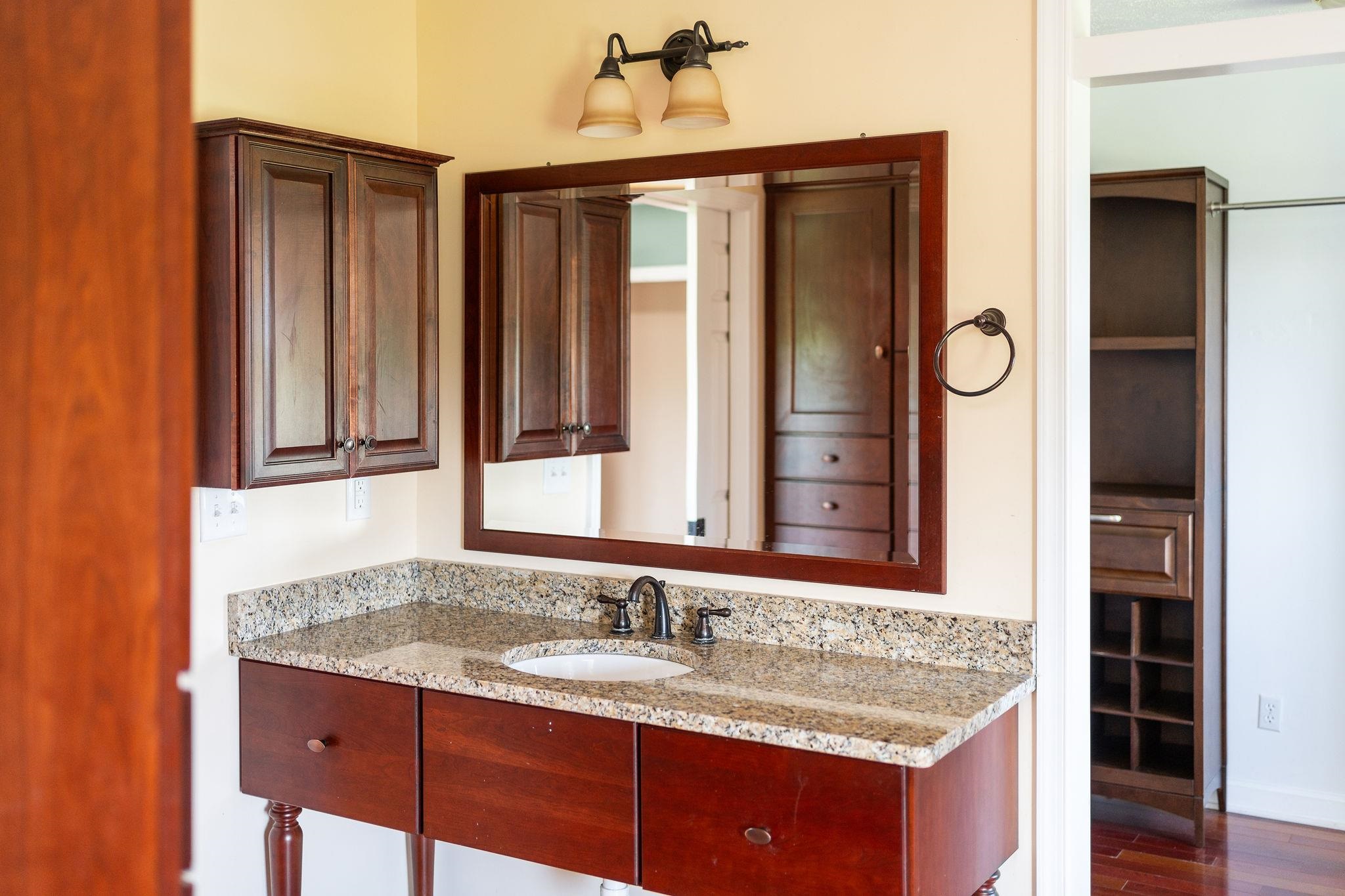 308 Stonewall Road Weyers Cave, VA 24486 - Photo 46 of 71 a bathroom with a granite countertop sink and a mirror
