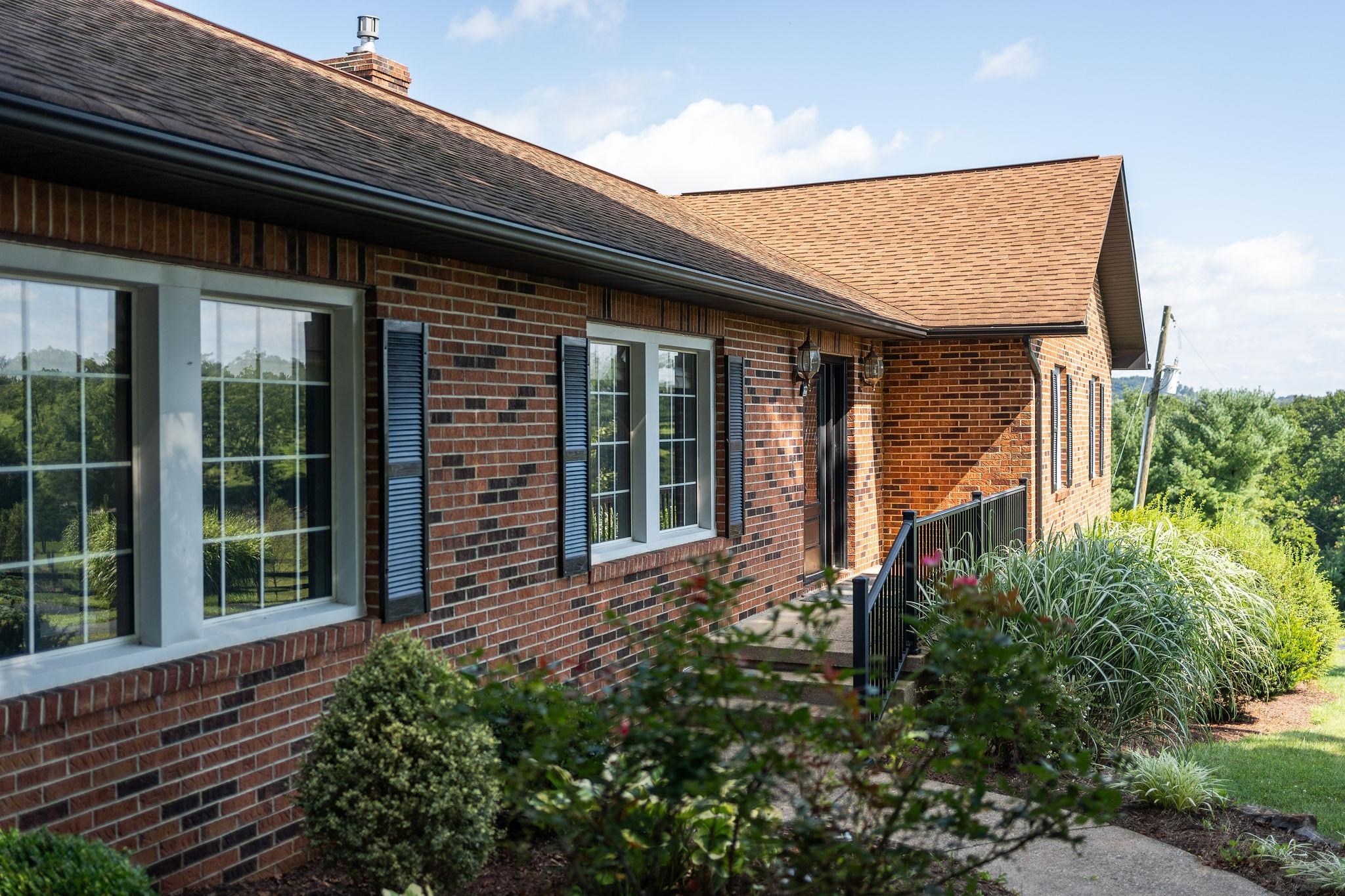 308 Stonewall Road Weyers Cave, VA 24486 - Photo 9 of 71 a front view of a house with garden