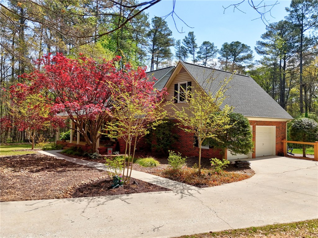 1010 Ridgeview Drive Pendleton, SC 29670 - Photo 45 of 47 This charming home offers a serene escape with vibrant landscaping and a welcoming entrance.