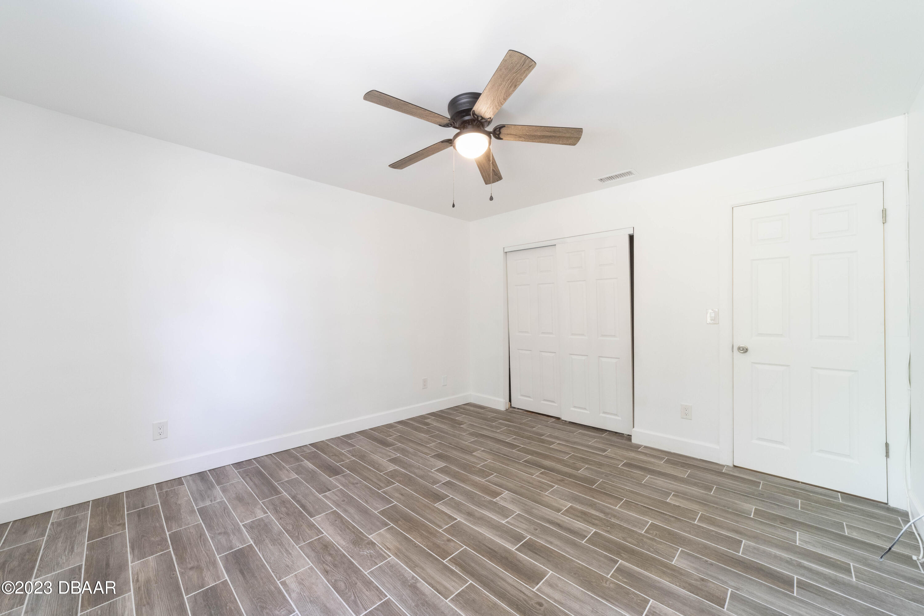 526 Live Oak Street, Unit 1050 Edgewater, FL 32132 - Photo 16 of 26 a view of empty room with wooden floor