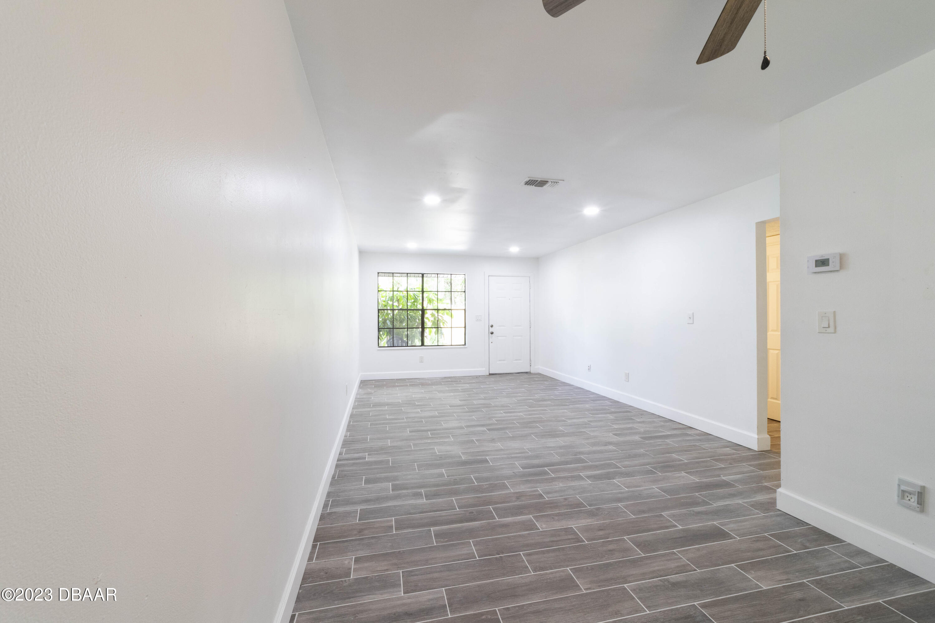 526 Live Oak Street, Unit 1050 Edgewater, FL 32132 - Photo 21 of 26 a view of an empty room and window