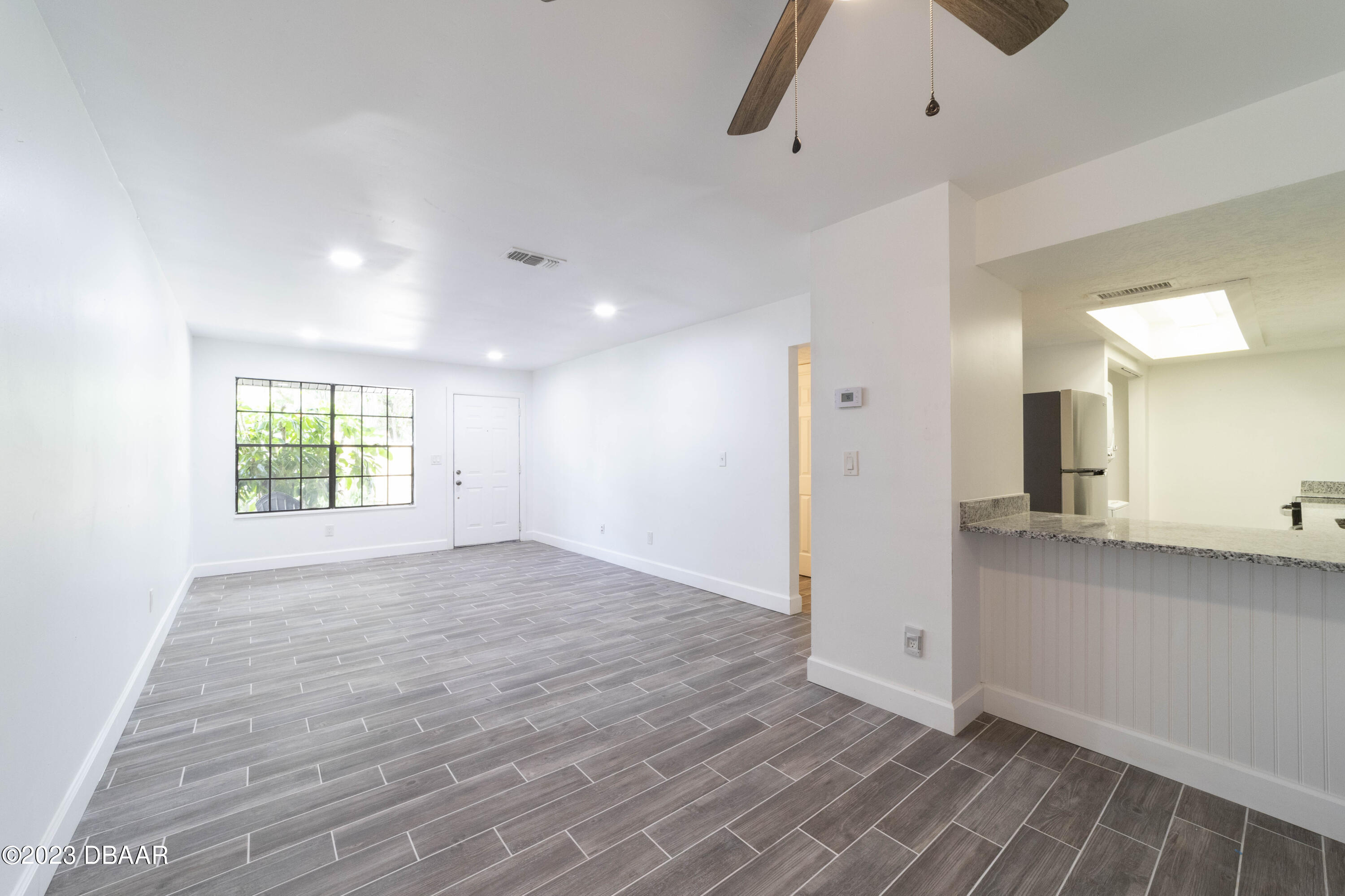 526 Live Oak Street, Unit 1050 Edgewater, FL 32132 - Photo 22 of 26 a view of an empty room with a window