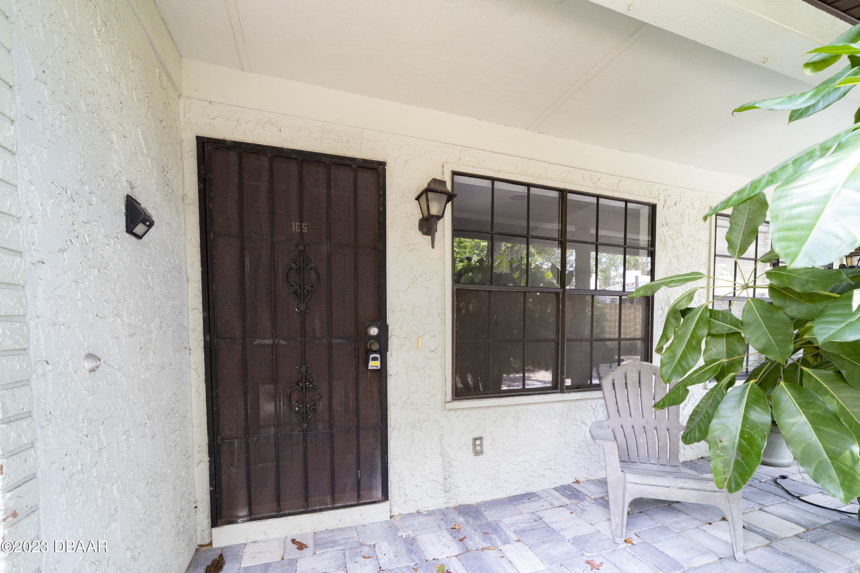 526 Live Oak Street, Unit 1050 Edgewater, FL 32132 - Photo 23 of 26 a bathroom with a shower and a tub