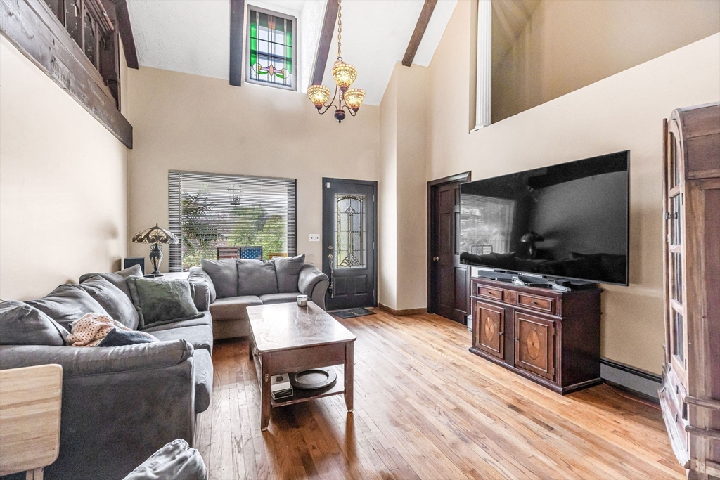 163 South Monson Road Hampden, MA 01036 - Photo 4 of 34 a living room with furniture and a flat screen tv