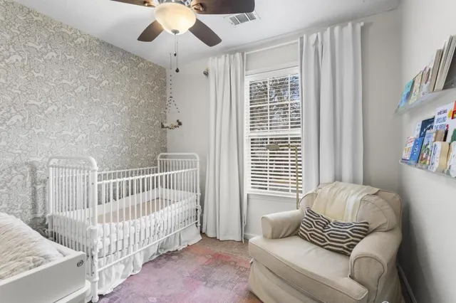a bedroom with furniture and a window
