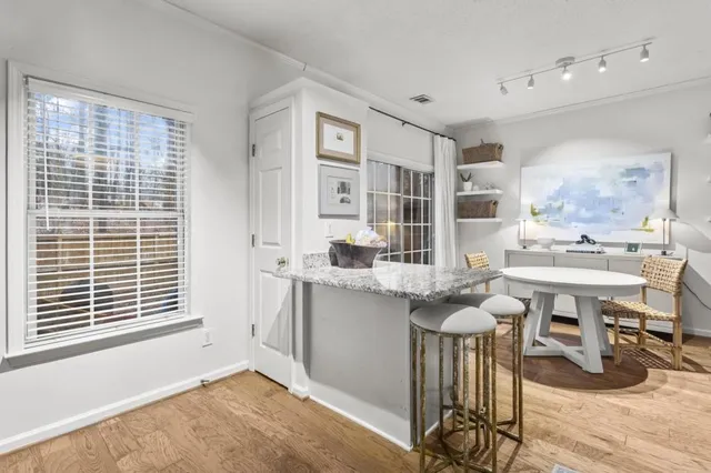 a kitchen with a sink cabinets and window