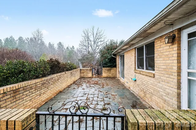 a view of a balcony with trees