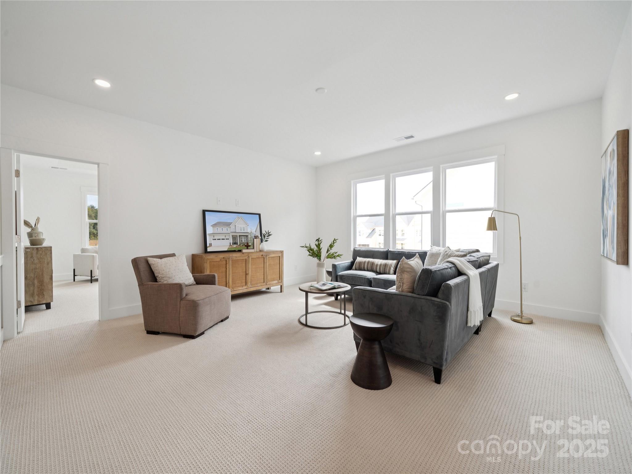 5311 Vernon Rdg Road, Unit 118 Huntersville, NC 28078 - Photo 13 of 22 a living room with furniture and a window