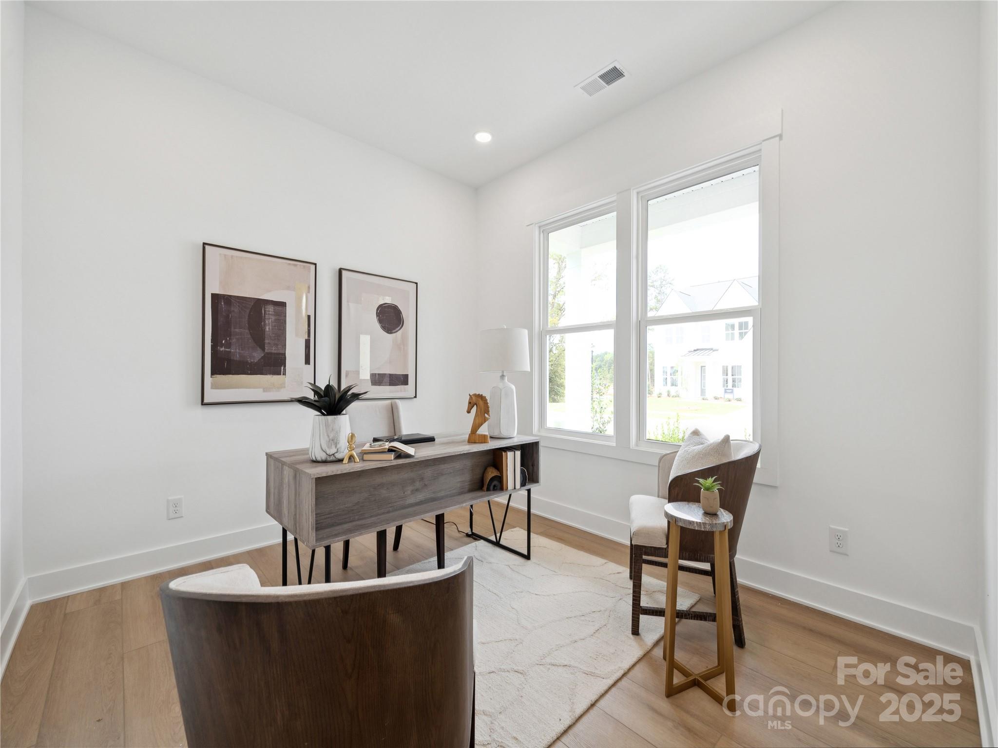 5311 Vernon Rdg Road, Unit 118 Huntersville, NC 28078 - Photo 19 of 22 a view of a dining room with furniture window and wooden floor