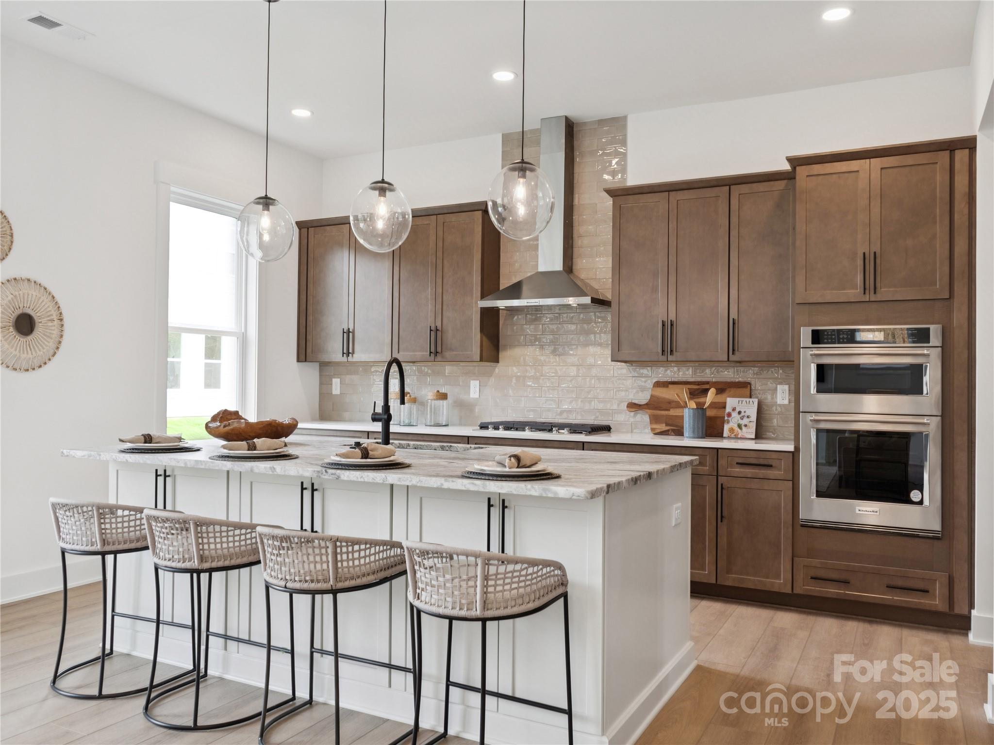 5311 Vernon Rdg Road, Unit 118 Huntersville, NC 28078 - Photo 2 of 22 a kitchen with stainless steel appliances granite countertop a stove a sink and a refrigerator