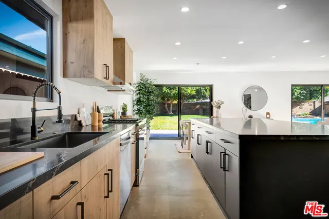 a spacious bedroom with a large bed and a large window