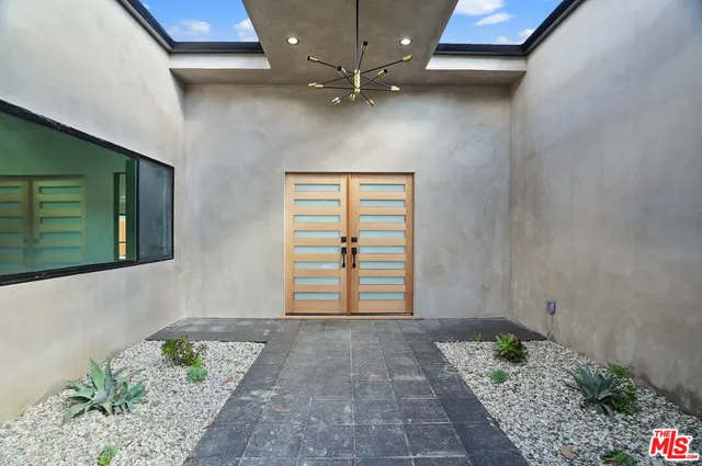 a kitchen with stainless steel appliances granite countertop refrigerator sink and cabinets