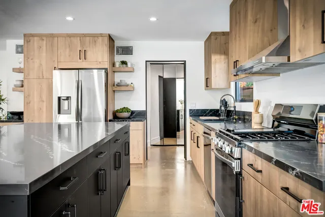 a bedroom with a bed and a potted plant