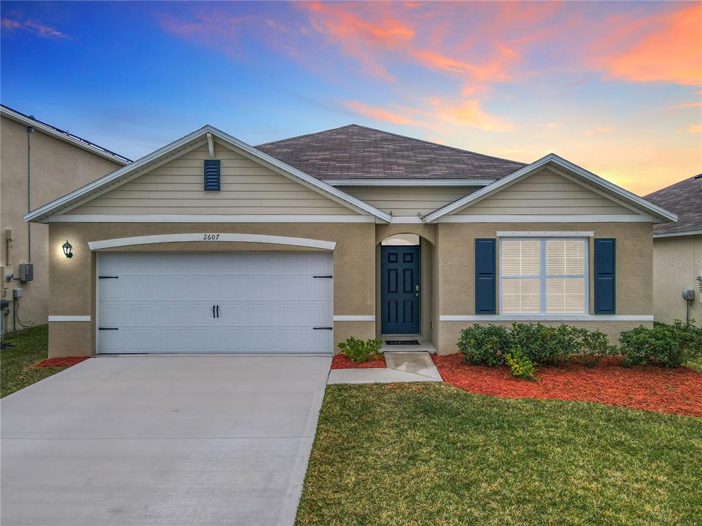 2607 Elmbrooke Way Edgewater, FL 32141 - Photo 15 of 52 a view of a house with a yard and plants