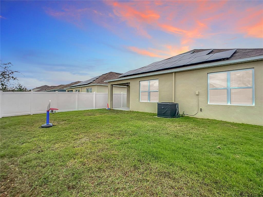 2607 Elmbrooke Way Edgewater, FL 32141 - Photo 16 of 52 a house view with a backyard space