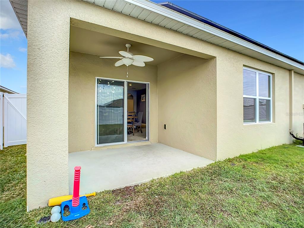 2607 Elmbrooke Way Edgewater, FL 32141 - Photo 18 of 52 a front view of a house with a yard