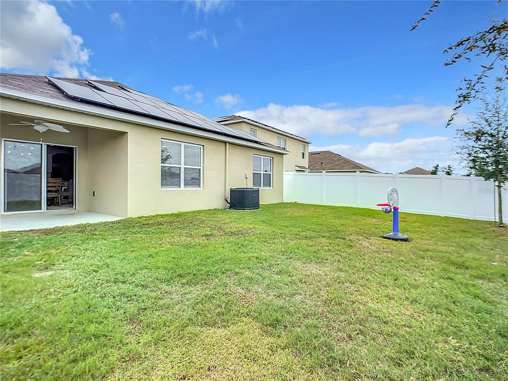 2607 Elmbrooke Way Edgewater, FL 32141 - Photo 21 of 52 a house view with a garden space