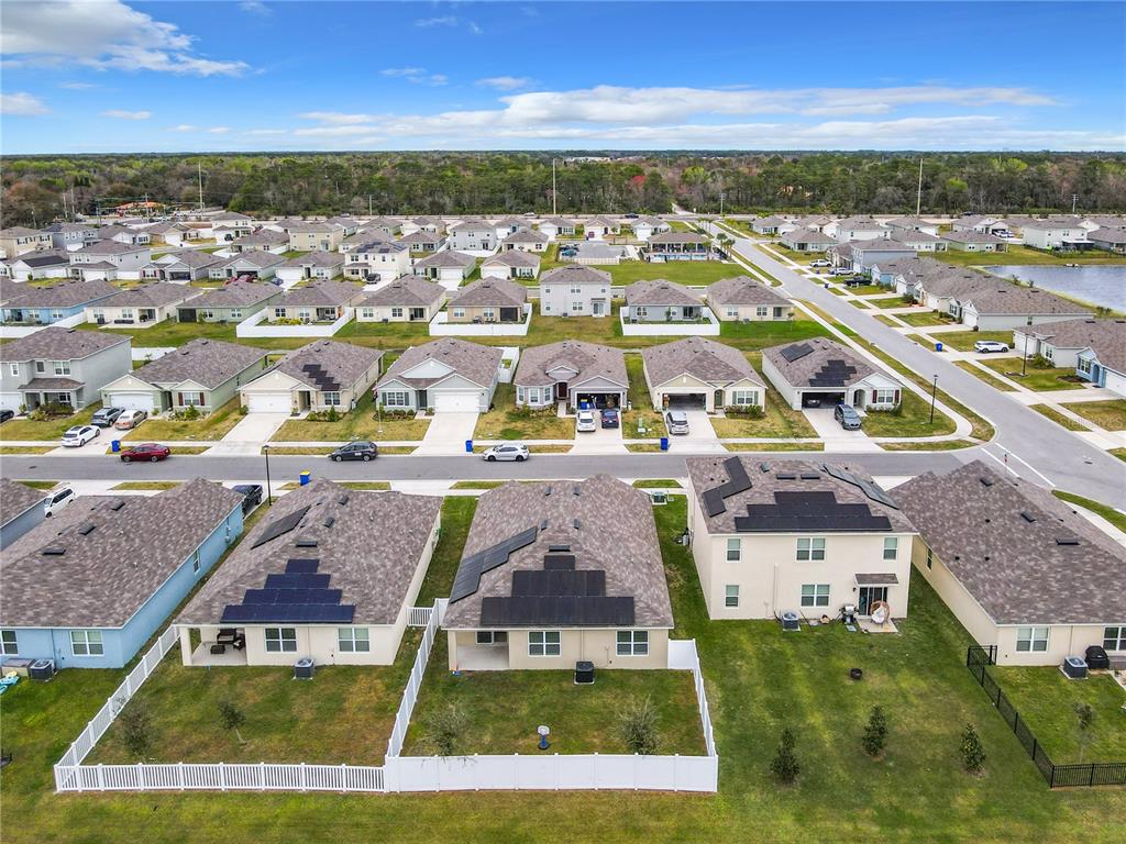 2607 Elmbrooke Way Edgewater, FL 32141 - Photo 24 of 52 an aerial view of residential houses with outdoor space