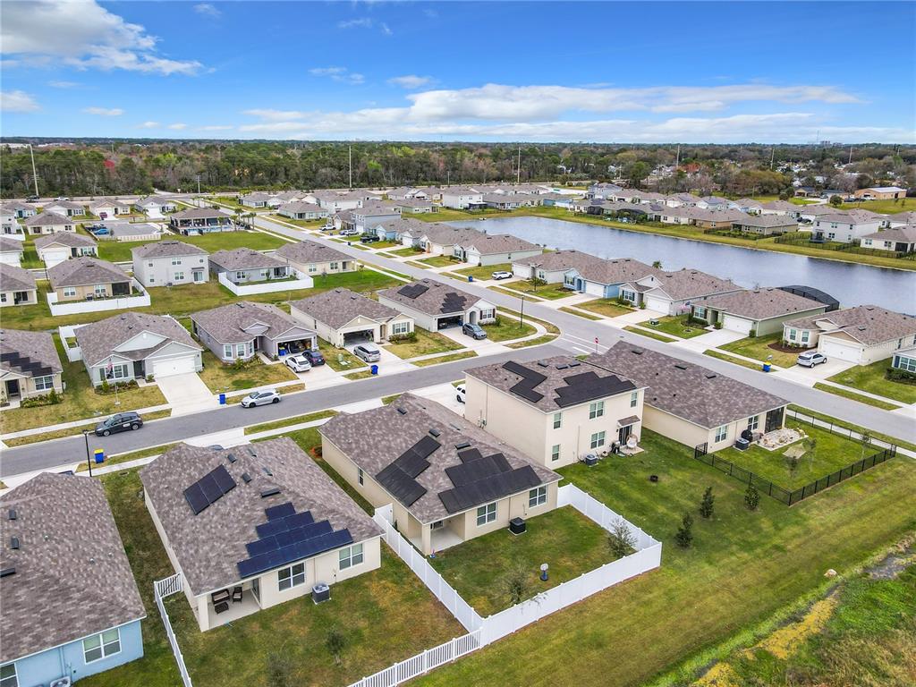 2607 Elmbrooke Way Edgewater, FL 32141 - Photo 25 of 52 an aerial view of residential houses with outdoor space