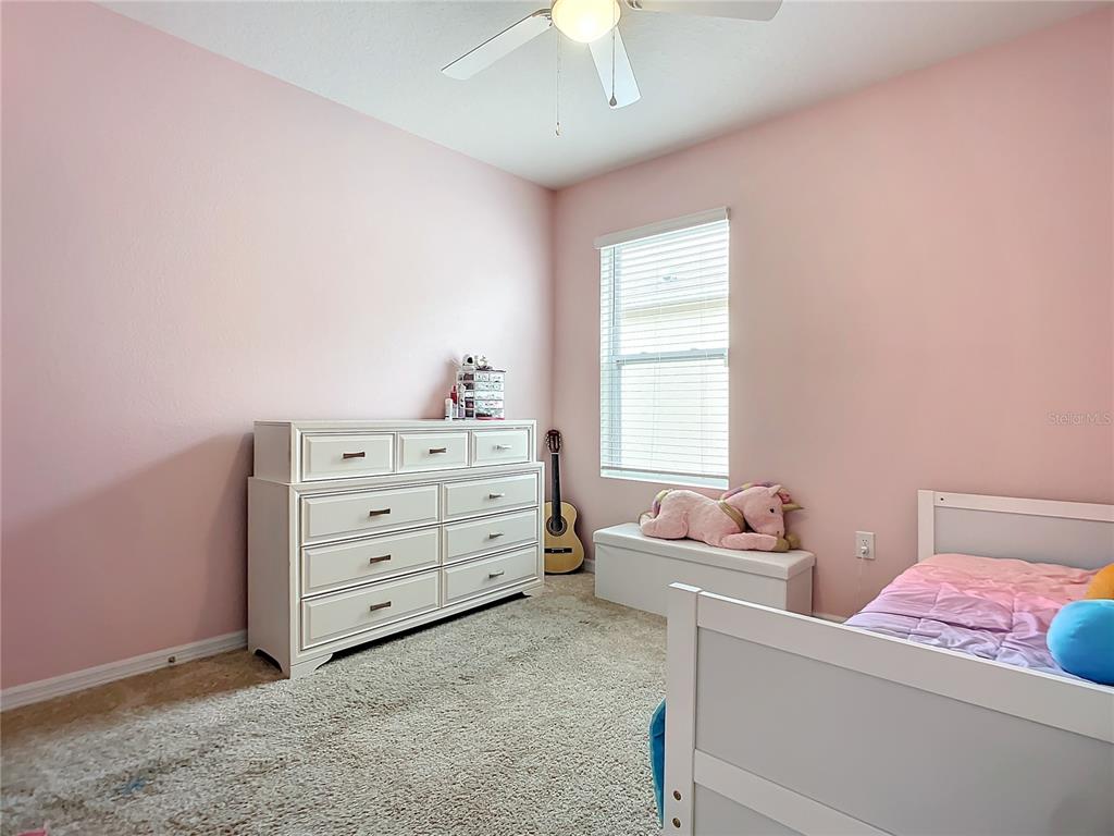 2607 Elmbrooke Way Edgewater, FL 32141 - Photo 31 of 52 a bedroom with a bed and a window