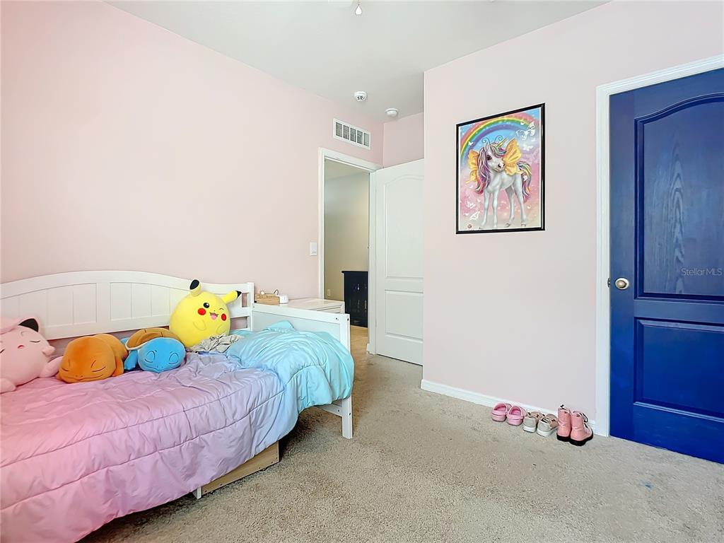 2607 Elmbrooke Way Edgewater, FL 32141 - Photo 33 of 52 a bedroom with bed and painting on the wall