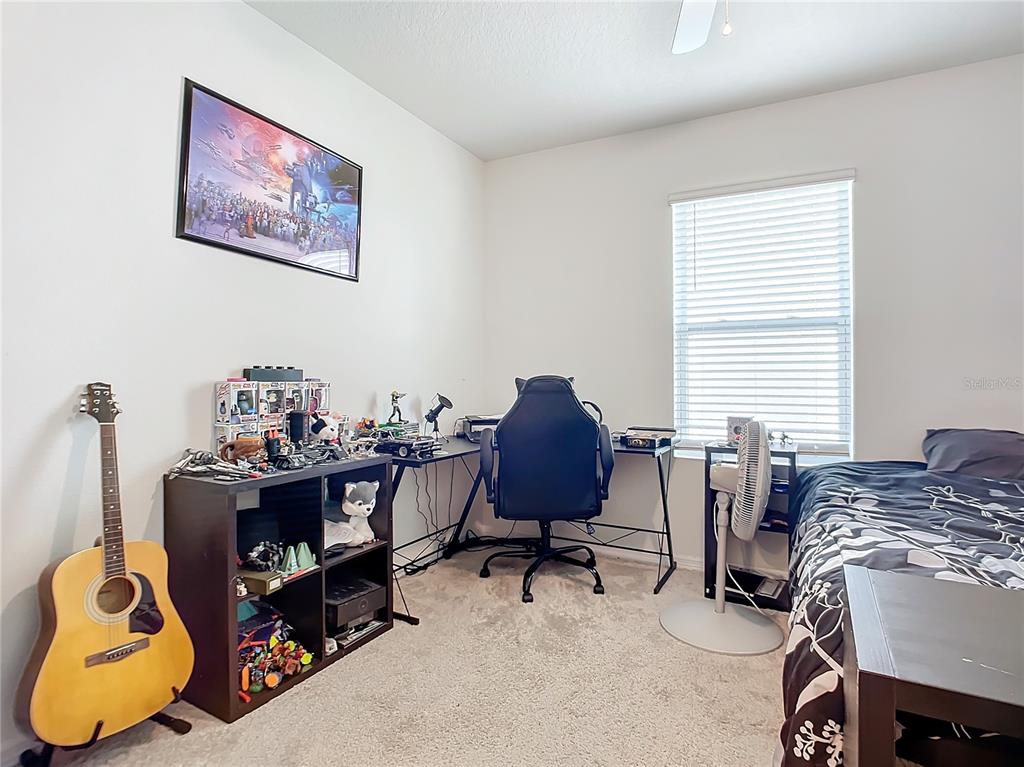 2607 Elmbrooke Way Edgewater, FL 32141 - Photo 37 of 52 a view of a workspace with furniture and a window