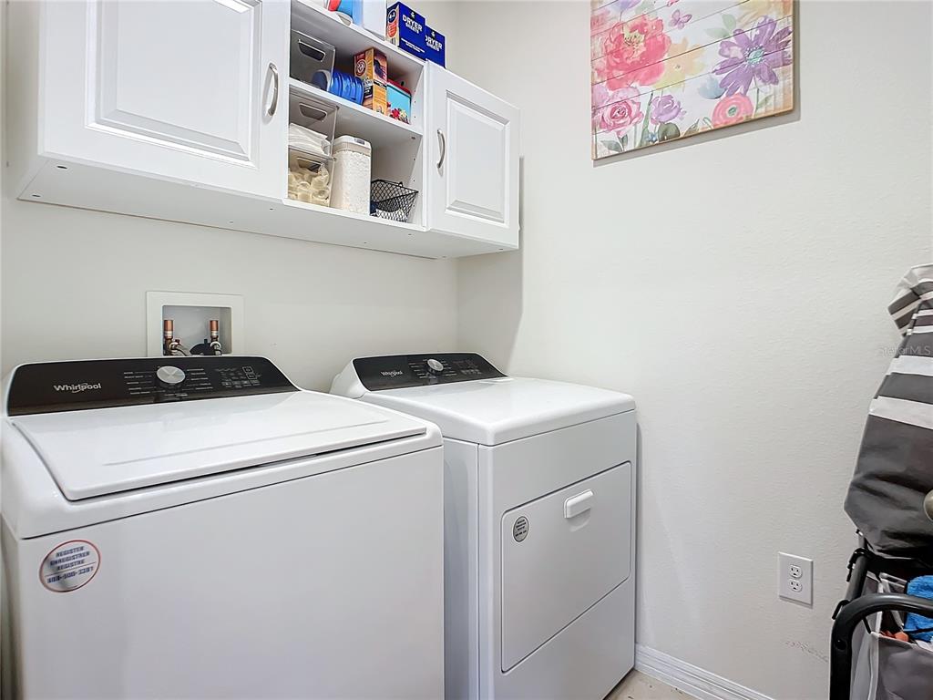2607 Elmbrooke Way Edgewater, FL 32141 - Photo 42 of 52 a utility room with dryer and washer