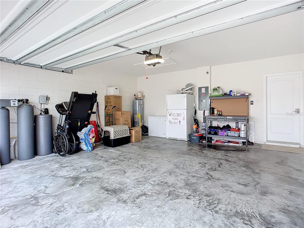 2607 Elmbrooke Way Edgewater, FL 32141 - Photo 43 of 52 a view of a garage with a bike and wooden roof