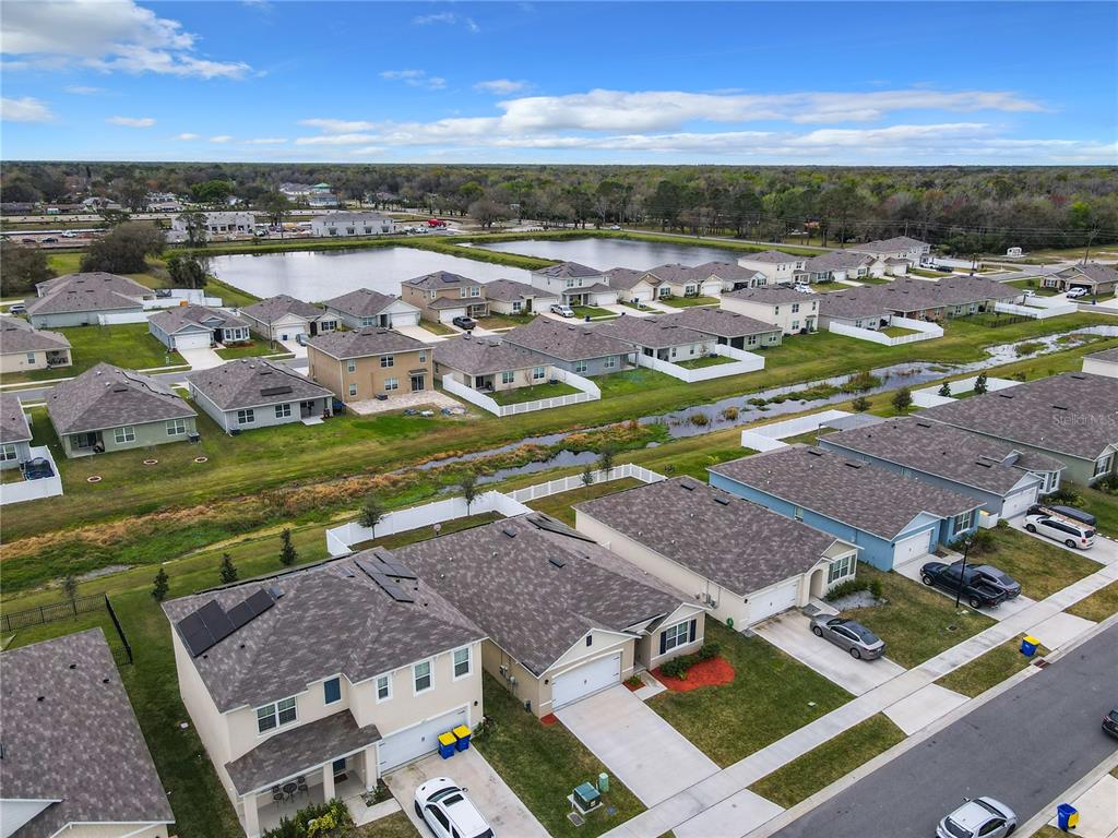 2607 Elmbrooke Way Edgewater, FL 32141 - Photo 45 of 52 an aerial view of residential houses with outdoor space