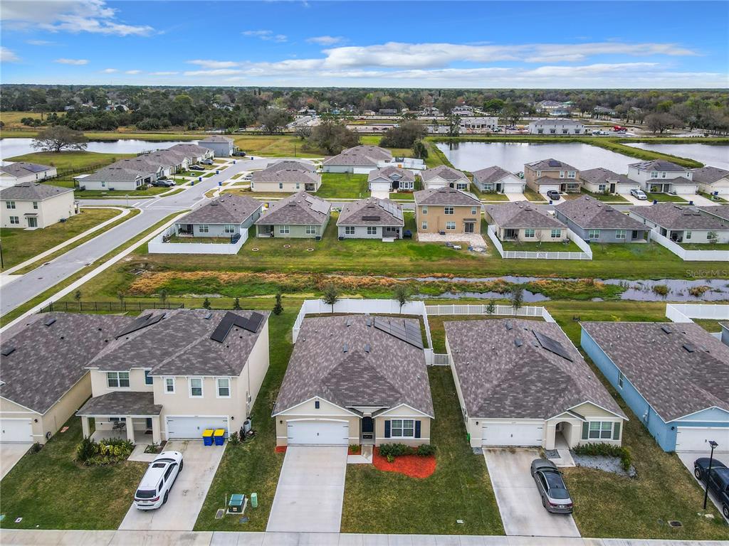2607 Elmbrooke Way Edgewater, FL 32141 - Photo 46 of 52 an aerial view of residential houses with outdoor space