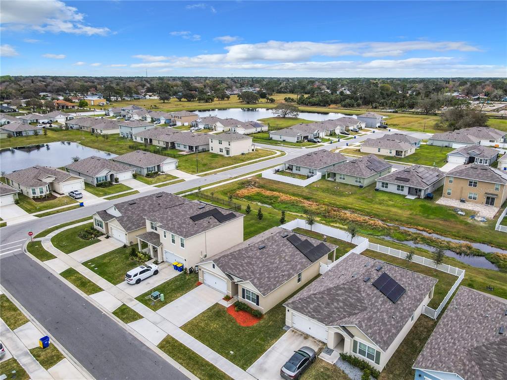 2607 Elmbrooke Way Edgewater, FL 32141 - Photo 47 of 52 an aerial view of residential houses with outdoor space