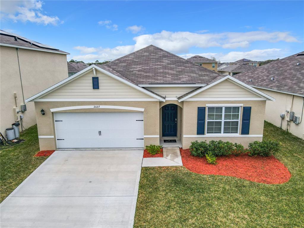 2607 Elmbrooke Way Edgewater, FL 32141 - Photo 50 of 52 a view of a house with backyard and garden